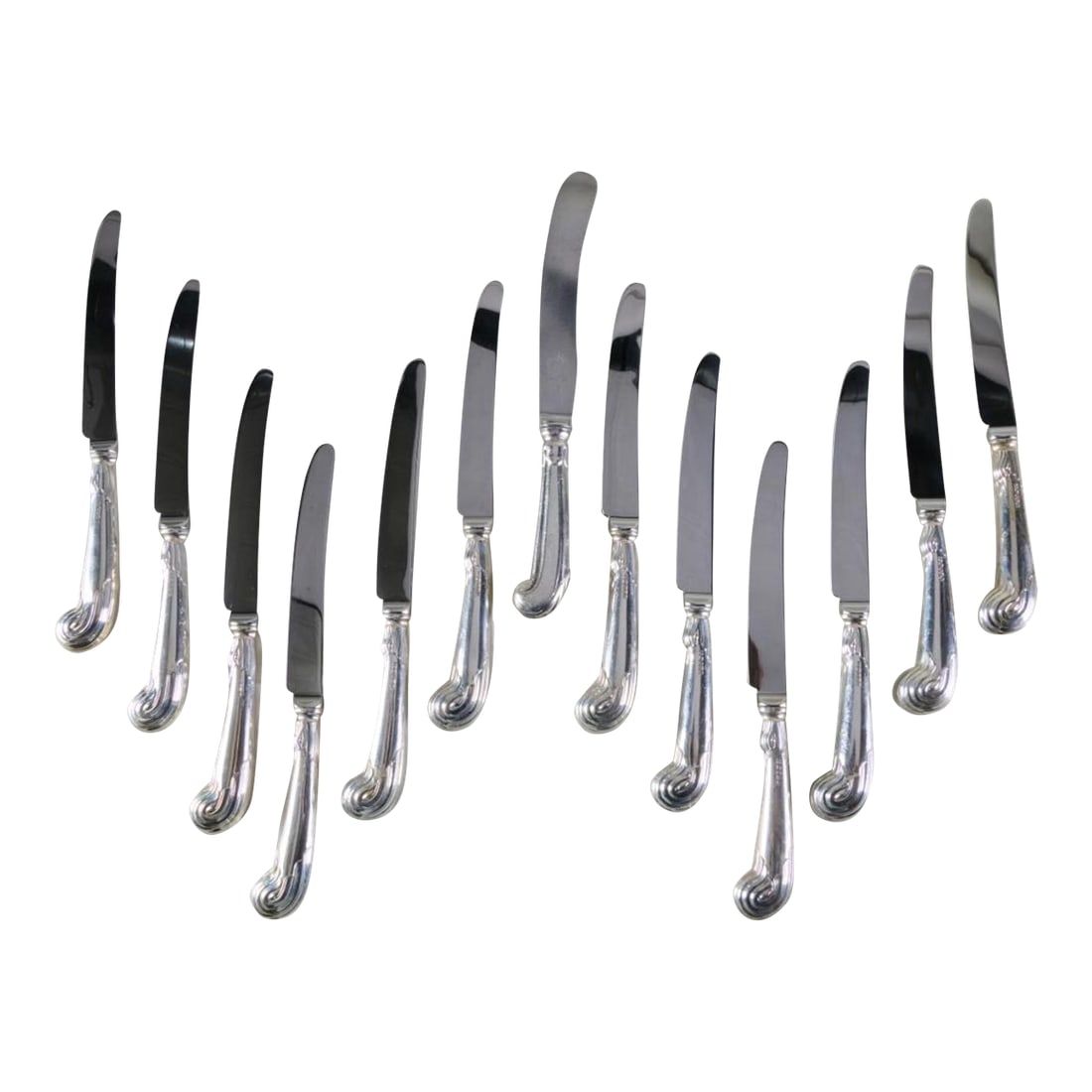 Late 20th Century Set of Thirteen Sterling Silver Elizabeth II Dinner Knives With Pistol Handles: Mark of Terry Shaverin, Sheffield, 2005; with steel blades and filled handles. Together with a similar knife with steel blades and filled handles. Would add to the chicness of any table 91/2 in.
