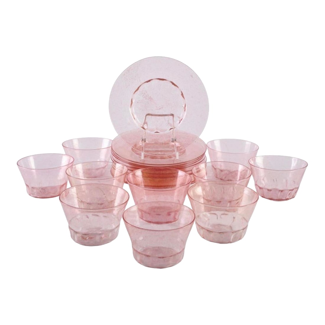 1920s Italian Murano Pink Blown Glass Dessert Service Bowls and Plates 10 Each: An unmarked set of ten plates and ten bowls in pink Murano glass The plates 71/2 in. diam., the bowls 21/2 * 41/4 in. diam., (20 pcs). Condition: Alterations: Original Condition Unaltered Imperfection
