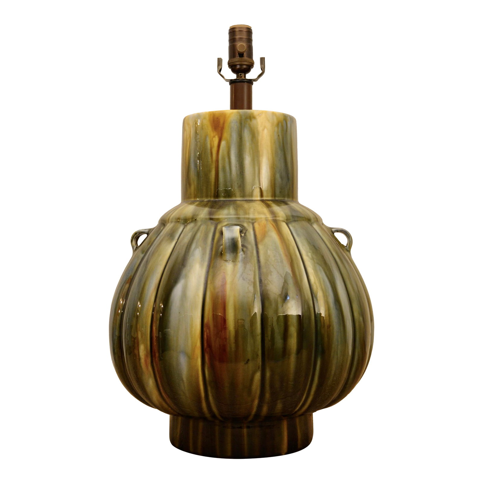 Mid 20th Century Monumental Glazed Ceramic Table Lamp: Monumental mid century ceramic lamp with beautiful ribbed shape and organic glaze of gold, green, brown, blue. New dimmer socket and twist fabric cord. 14" x 23" Condition: Alterations: Restored