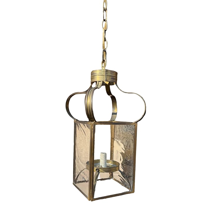 Hand Forged Antique Brass Lighting by McLean Lighting Works: Freeman House pendent light in antique brass finish holds up to a 60 watt candelabra bulb. Has a 20" drop, beautiful wavy and pitted glass inserts and 12" drop chain. Condition: Alterations: Original 