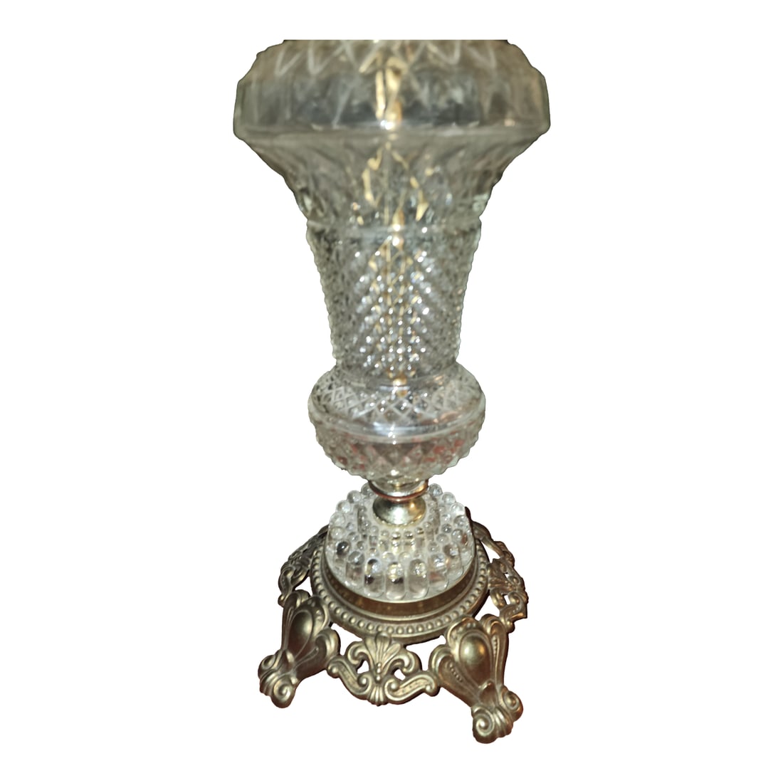 Pair of Vintage 1967 Hollywood Regency Pressed Glass & Ornate Brass Table Lamps: A striking pair of vintage mid-century table lamps, dated 1967. These lamps feature a heavy, clear pressed glass body with a "diamond point" or "waffle" texture that beautifully mimics cut crystal. Th