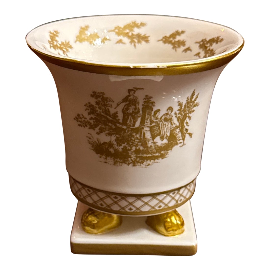 Cache Pot: Vintage white porcelain French empire style cache pot with gold gilt decoration, foliate sprays, toile, latticework, and lions paw feet. Apparently unmarked. Condition: Alterations: Original