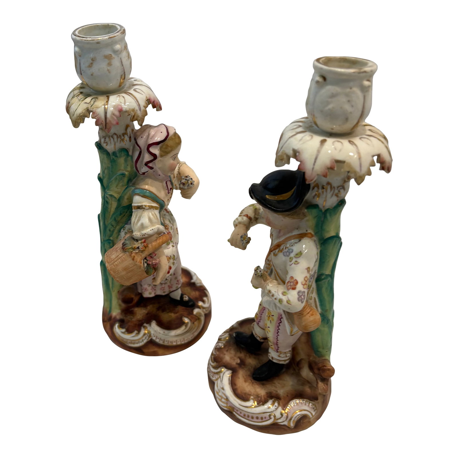 Pair Antique Meissen Figural Candlesticks: This unique pair of figural candlesticks was made by the French Sevres porcelain factory in the 19th C. The candlesticks depict a charming couple dressed in the garb of a French provincial pair..