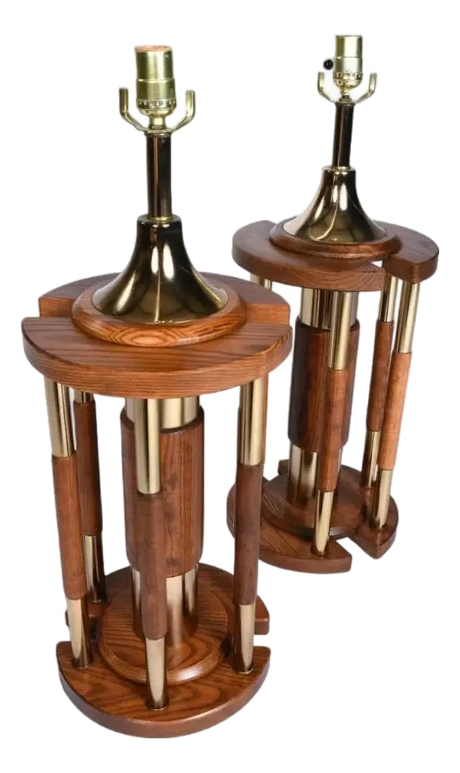 Pair Post Modern Gold Brass and Oak Wood Large Table Lamps: Vintage 1970s jumbo table lamps with architectural rotunda design. The cylindrical lamps feature an array of gold colored brass and oak pillars. The brass plated metal with solid oak accents are a tru
