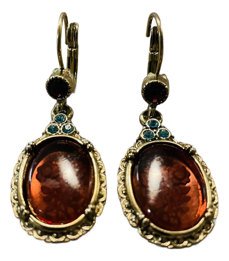 Vintage Art Nouveau Style Etched Floral Amber Dangle Earrings, A Pair: These gorgeous vintage dangle earrings feature large, oval amber-colored cabochons with a delicate hand-etched floral motif. The warm, cognac-hued stones are set in ornate, gold-toned frames with an