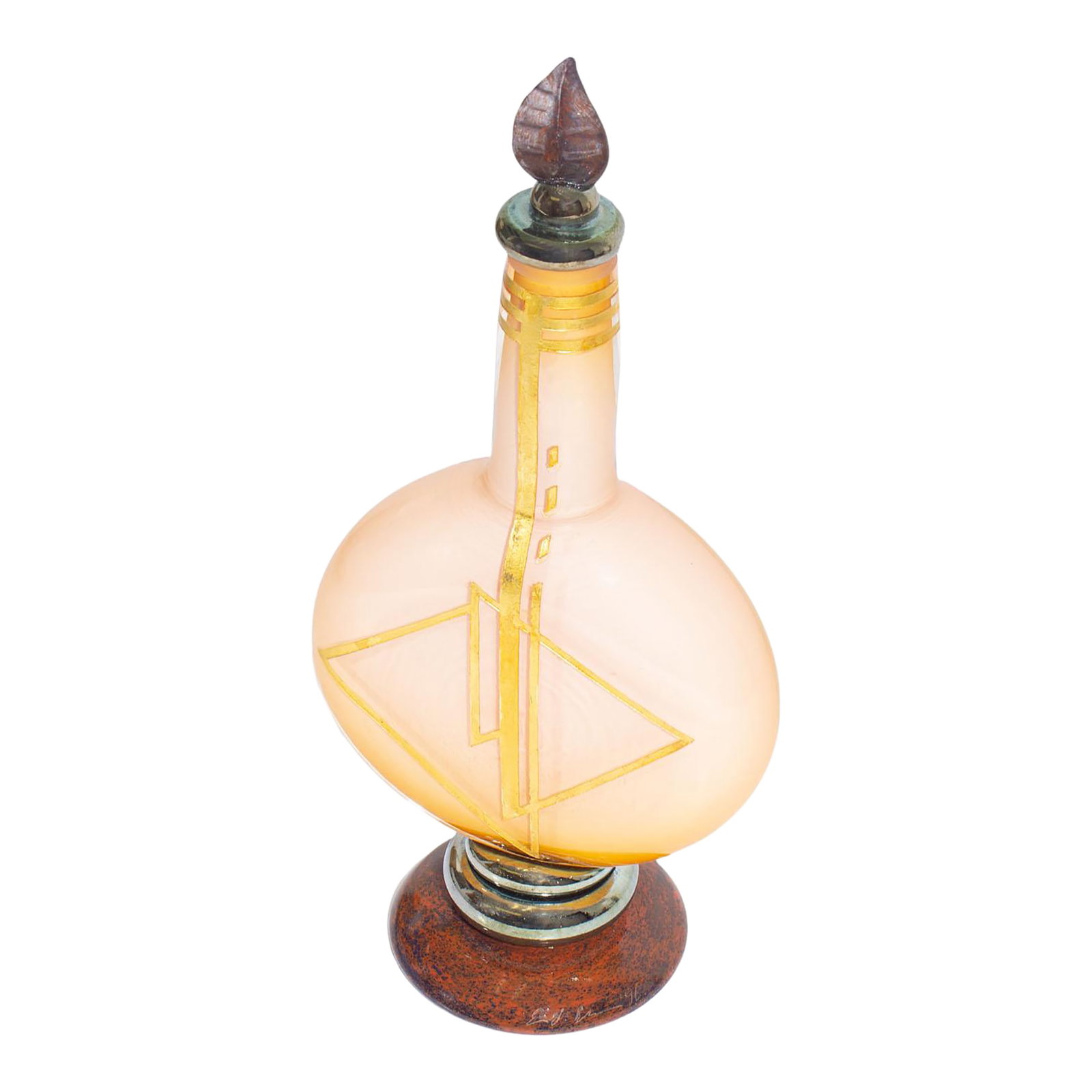 Signed 1996 Art Glass Decanter Bottle by Eric Bladholm: A 1996 art glass decanter or bottle by the American glass artist Eric Bladholm. This art glass piece features a pale pink body with gold tone geometric design to the front. The work has a leaf-shaped 