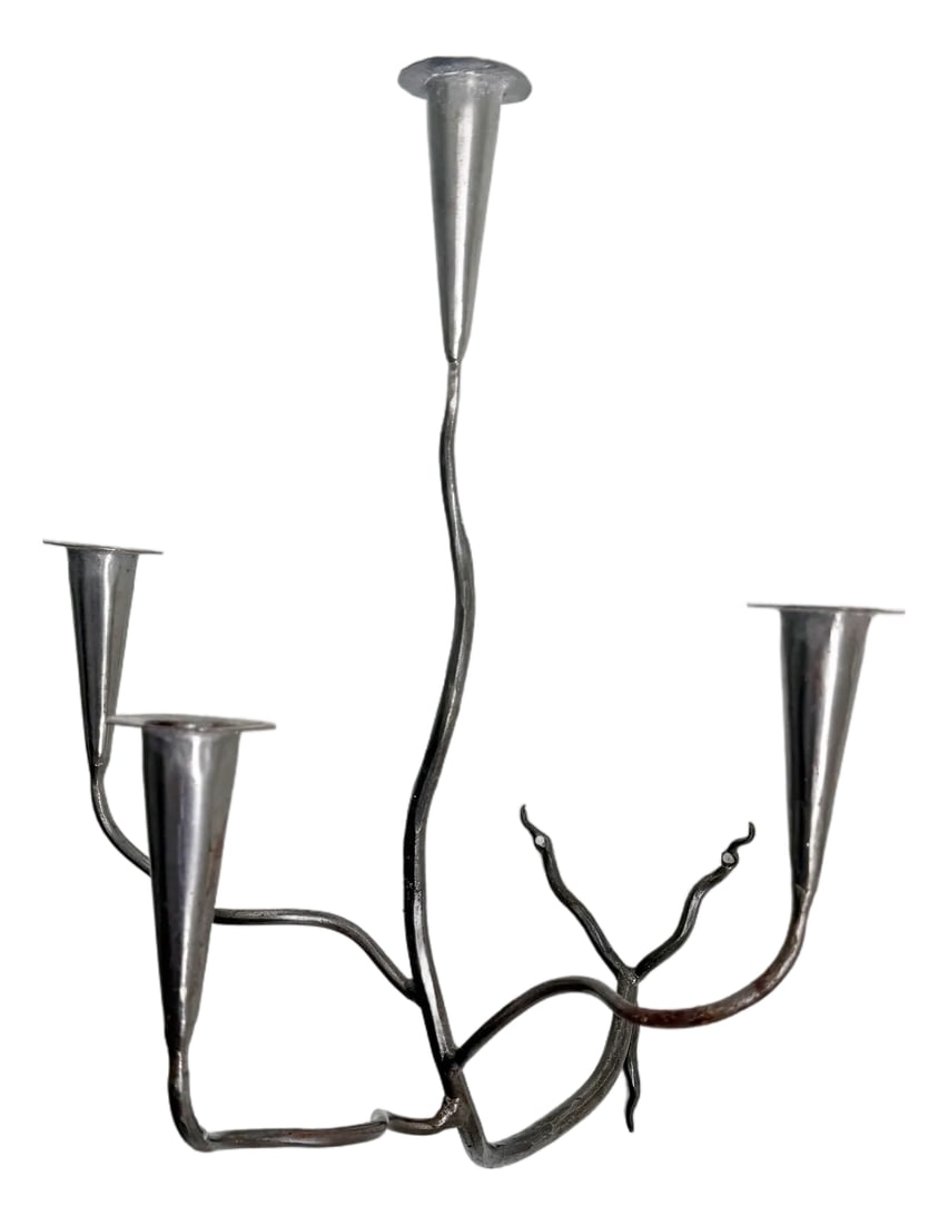 Hand-Forged Metal Wall Sconce Candelabra: Sculptural mid-20th-century hand-forged wall sconce candle holder. Featuring an aged steel finish and four taper candle holders held by curving tree limb-like arms. Unmarked. Includes two holes for wa