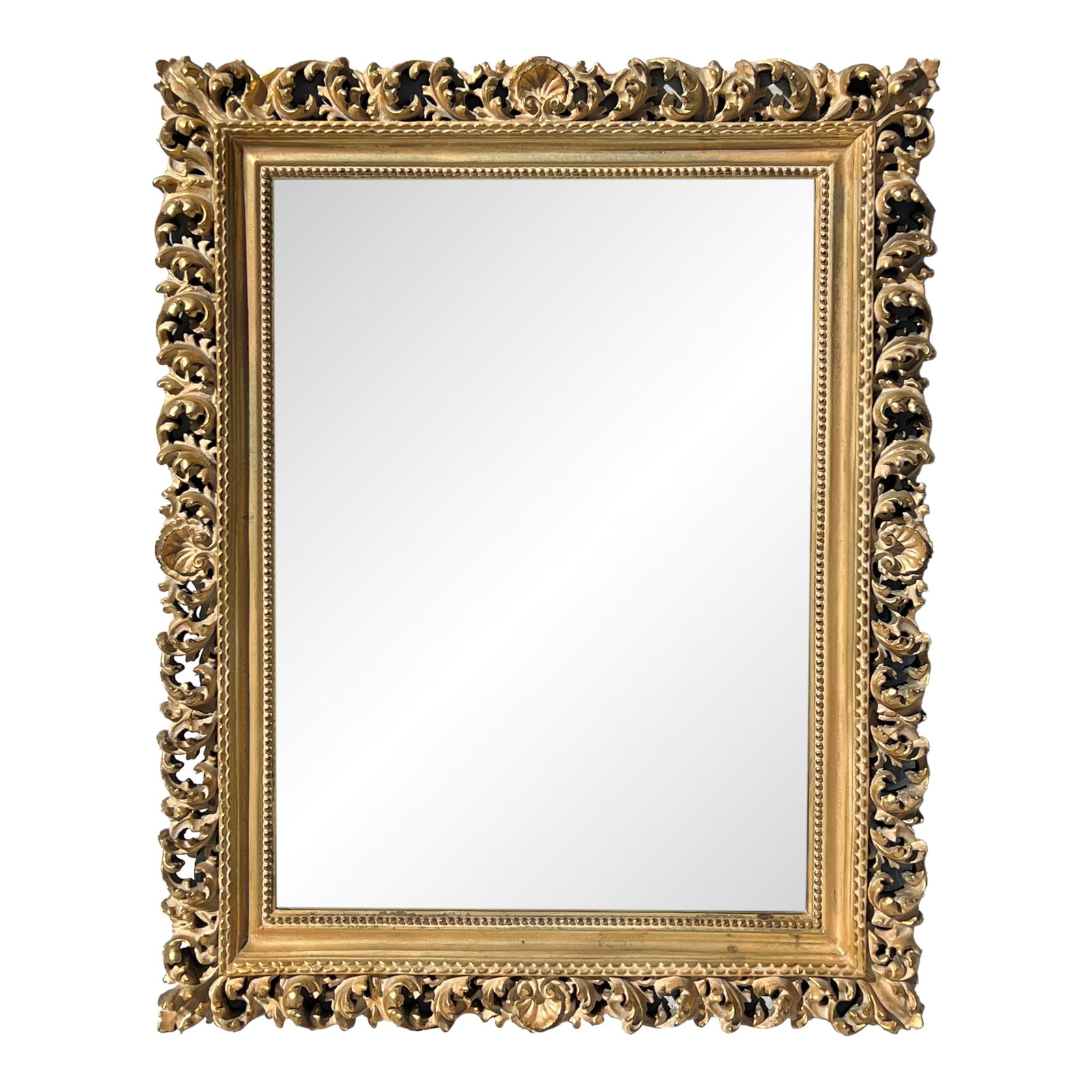 Vintage Florentine Style Shell & Acanthus Leaf Mirror: A 19th century Florentine style wall mirror with an ornate gilt frame. We commissioned this mirror for our store in the 1980s from a wonderful family-owned factory in Mexico. It was styled after an