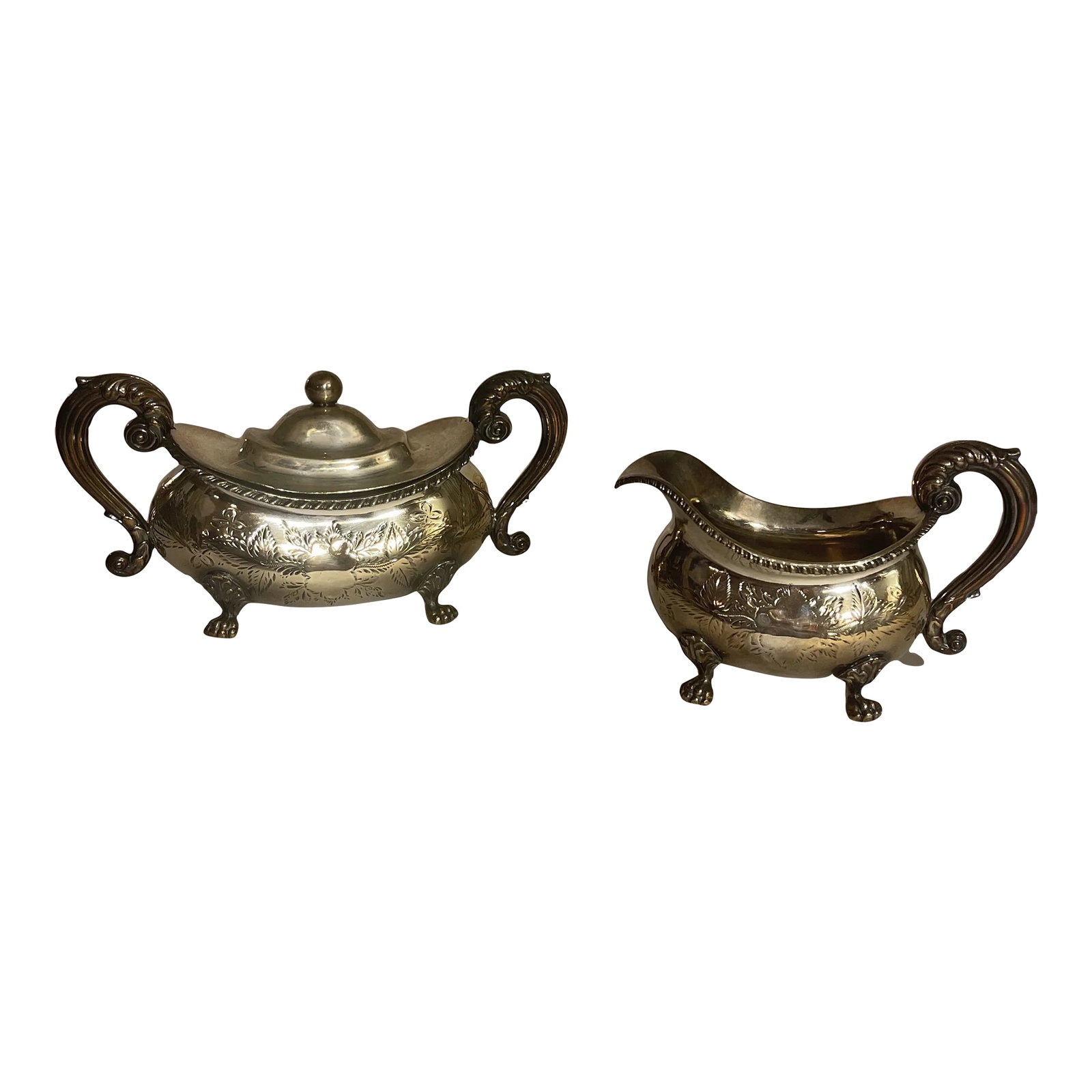 Antique English Sheffield Plate Sugar & Creamer Set- 2 Pieces: Georgian George IV Period Regency style Double handled Sucrier or Sugar with a lid and creamer pitcher. Acanthus scrolled handles with lions paw feet. Hand chased decoration in floral and Foliate