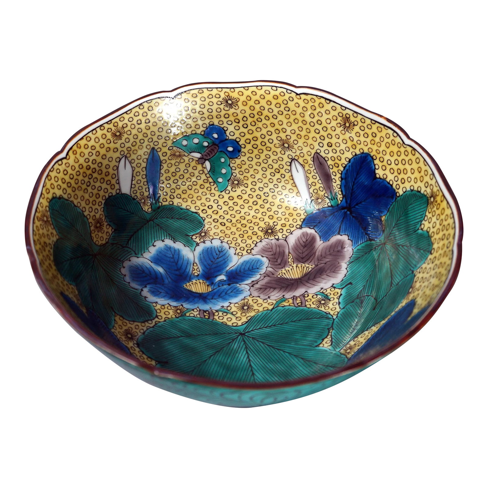 Antique Kutani Bowl in Floral Design: The Kutani kilns (meaning nine valleys) are located in Kaga, Ishikawa Prefecture on the southeast part of the Island of Honshu. The kilns has a long history of which the Ko-Kutani (old Kutani)pieces f