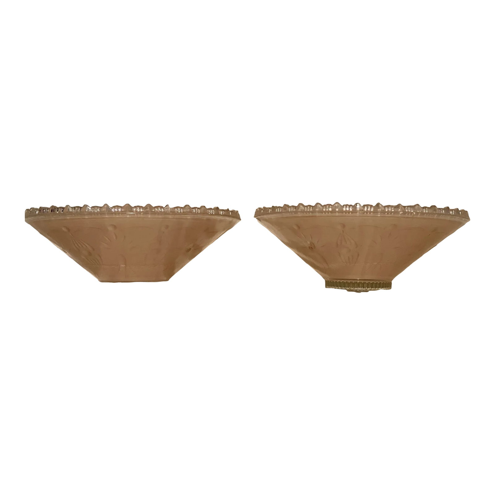 1930's Era Blush Art Deco Glass Ceiling Shades-A Pair: A pair of Art Deco glass ceiling shades in a pale blush pink/peach color flashed on the interior of the shades. The shades have a floral design around the perimeter, classic Art Deco steppes edge deta