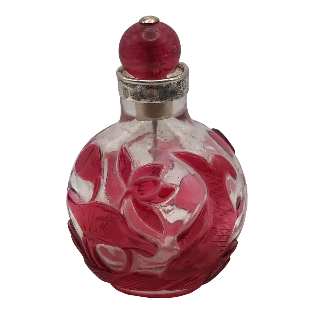 Antique Beijing Glass Snuff Bottle With Red Glass Overlay: The glass bottle has an older "feel" perhaps by the way it looks. Its flattened globular shape tapers to a short oval foot of red glass. A red overlay in designs of floral elements including an