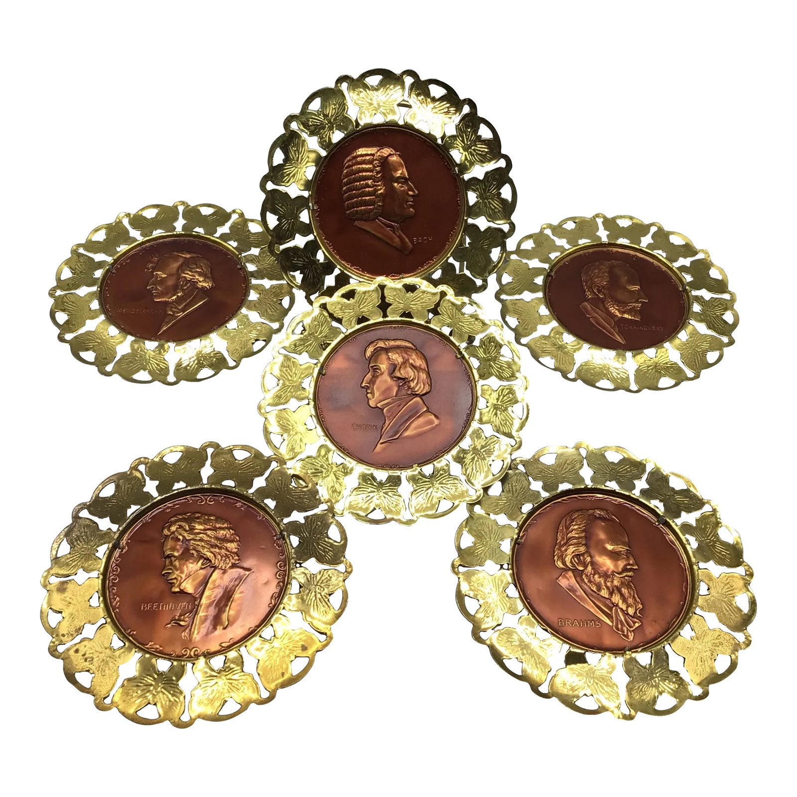 Wall Plates Influential Composers Stamped on Yellow Brass and Butterfly Filigree Made in England-Set: Here is a set of 6 yellow brass butterfly filigree edged hanging wall plates. The plates consists of 6 of the worlds most important composers and they are Tchaikovsky, Mendelssohn, Chopin, Bach,