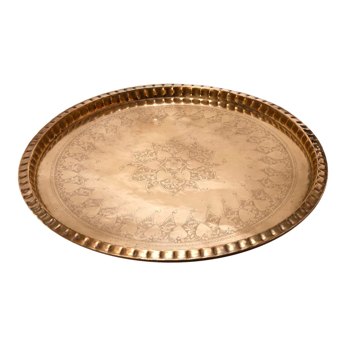 Antique Large Round Etched Bronze Tray with Heart Motif: Polished brass Moorish style tray finely hand-hammered edge & etching in a pattern of linked hearts & foliage. In very good condition. Good size to easily move in or outdoors. Rare pattern not in