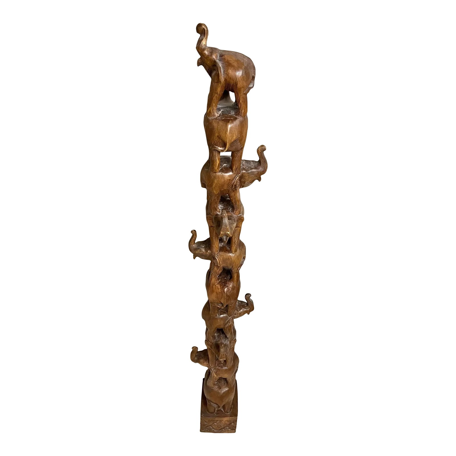 1980s Carved Elephant Tower: Beautiful carved wood tower of elephants. This is one piece of wood that has been carved with 10 elephants purchased in Sun City, Africa in the 1980's .The base is about 7.5" x 8". Condition: