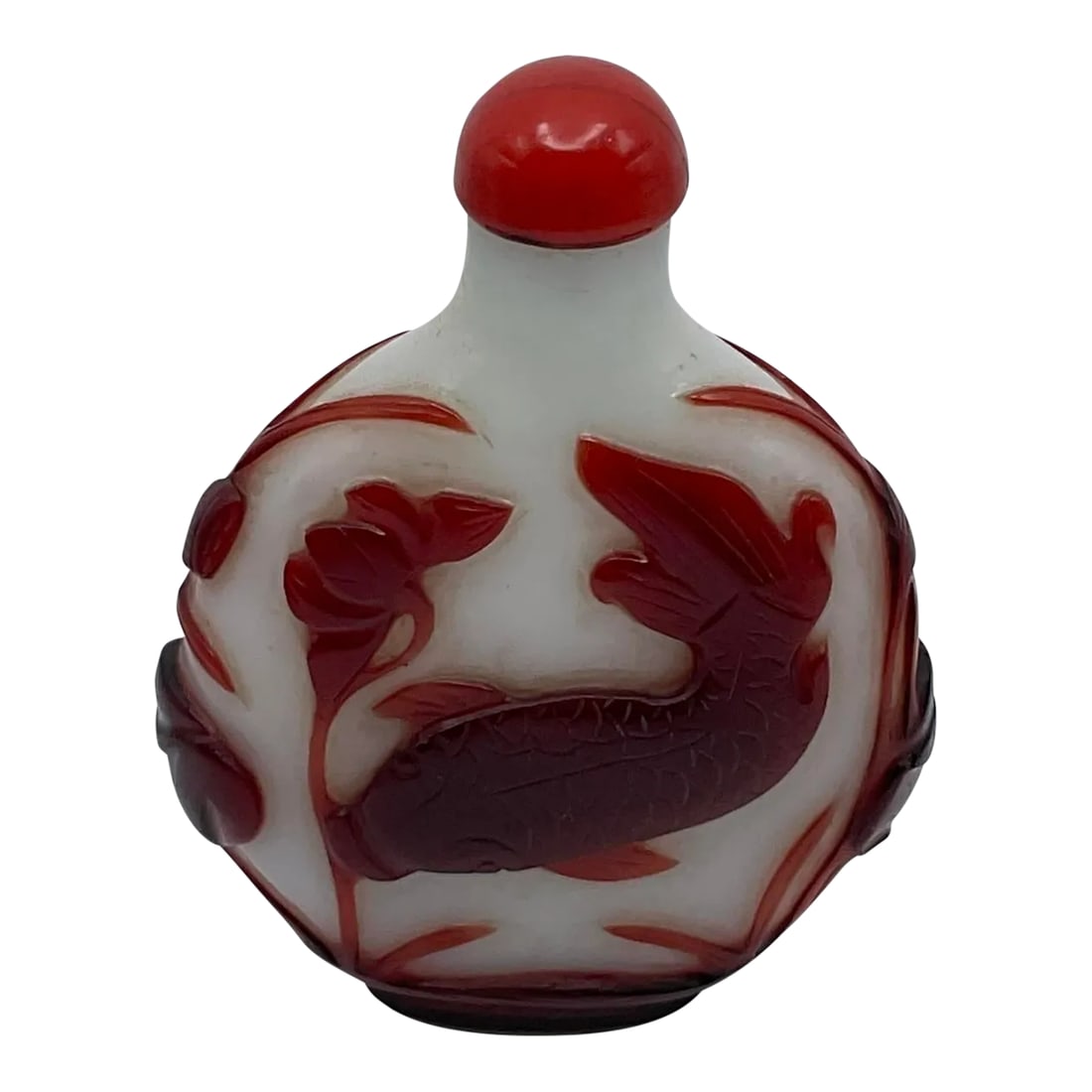 Early 20th Century Oversize Large Opaline Glass Snuff Bottle With Red Overlay of Fish Design: This oversize opaline or milk glass bottle is extremely well made. The red overlay is this=ck and well carved. Its flatterned round form is a good background for the design composing of a swimming