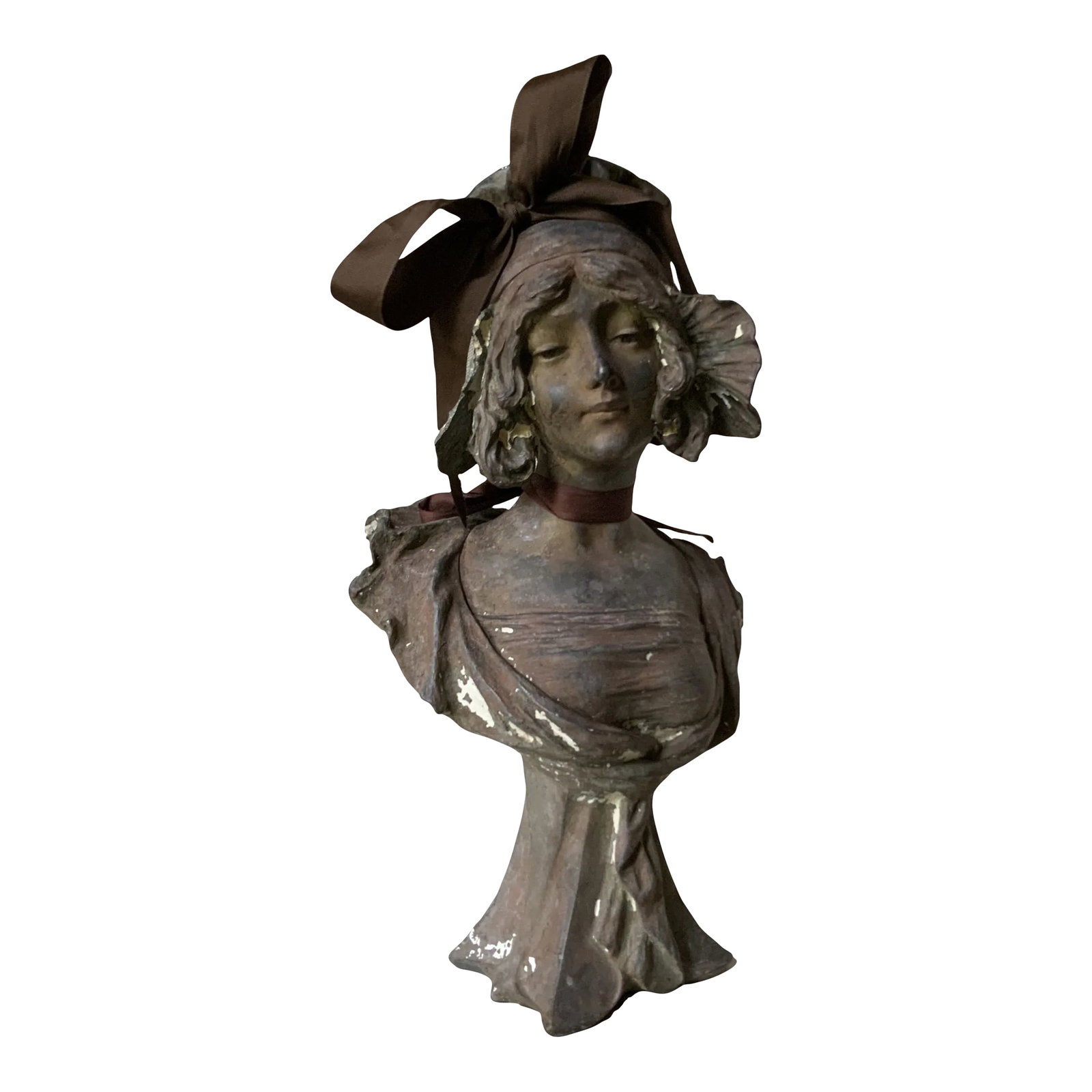 Antique French Art Nouveau Cast Iron Bust of a "Coquette" After Pablo Rigual: The StoryThe heavy morning fog was still rising off the gravel paths when we first spotted her. She was tucked away in the back corner of a sprawling open-air stall at a bustling marche aux puces