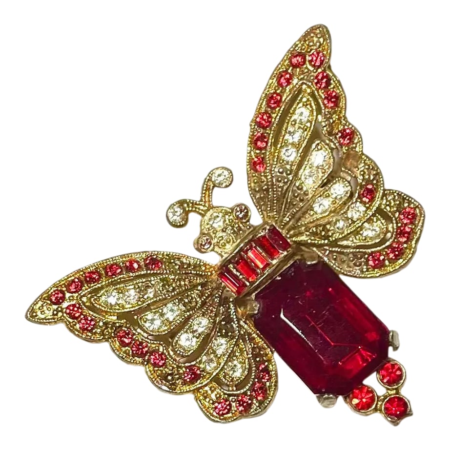 1930s Butterfly Brooche: This is part of Chairish's Costume Jewelry assortment. Butterflies are all about change. And this charmer of a butterfly pin can inspire a metamorphosis. 1930s construction and red and rhinestone