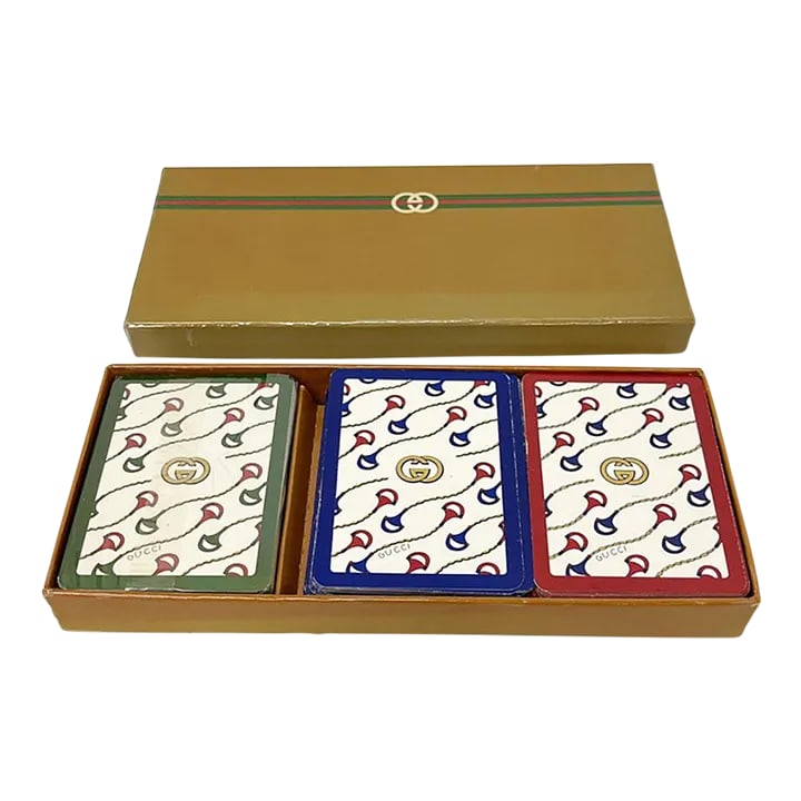 Vintage Gucci Playing Cards, 1970s Italy: Rare Gucci three decks of playing cards in the original box. One complete deck still in the package with two jokers and a bridge card in each deck in French. Makes a perfect gift for the Gucci