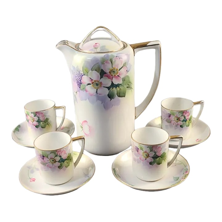 Vintage Nippon Hand-Painted Fine Porcelain Floral Chocolate Tea Set- 9 Pieces: We are pleased to be offering this gorgeous Nippon chocolate set hand painted in a beautiful delicate floral pattern, marked on the bottom, consisting of four cups and saucers and pot with lid. Good