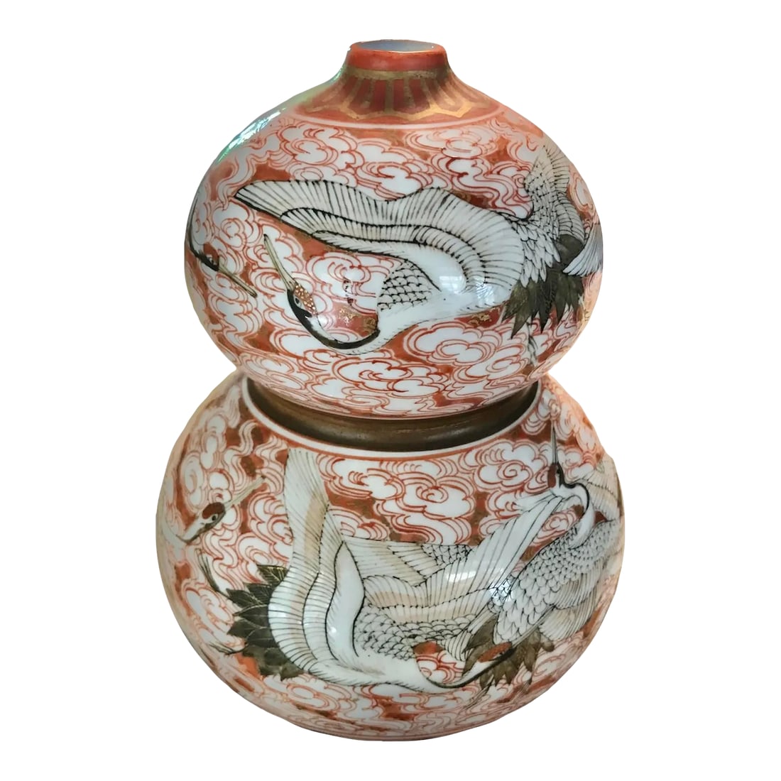 1940s Kutani Ware Handcrafted Ceramic Vessel Gourd Shape Japan: Exotic gourd shape Kutani ceramic vase with flying Cranes decoration from Mid Century Japan. The hand painting was done with great care and artistic knowledge. The vase is painted with swirling