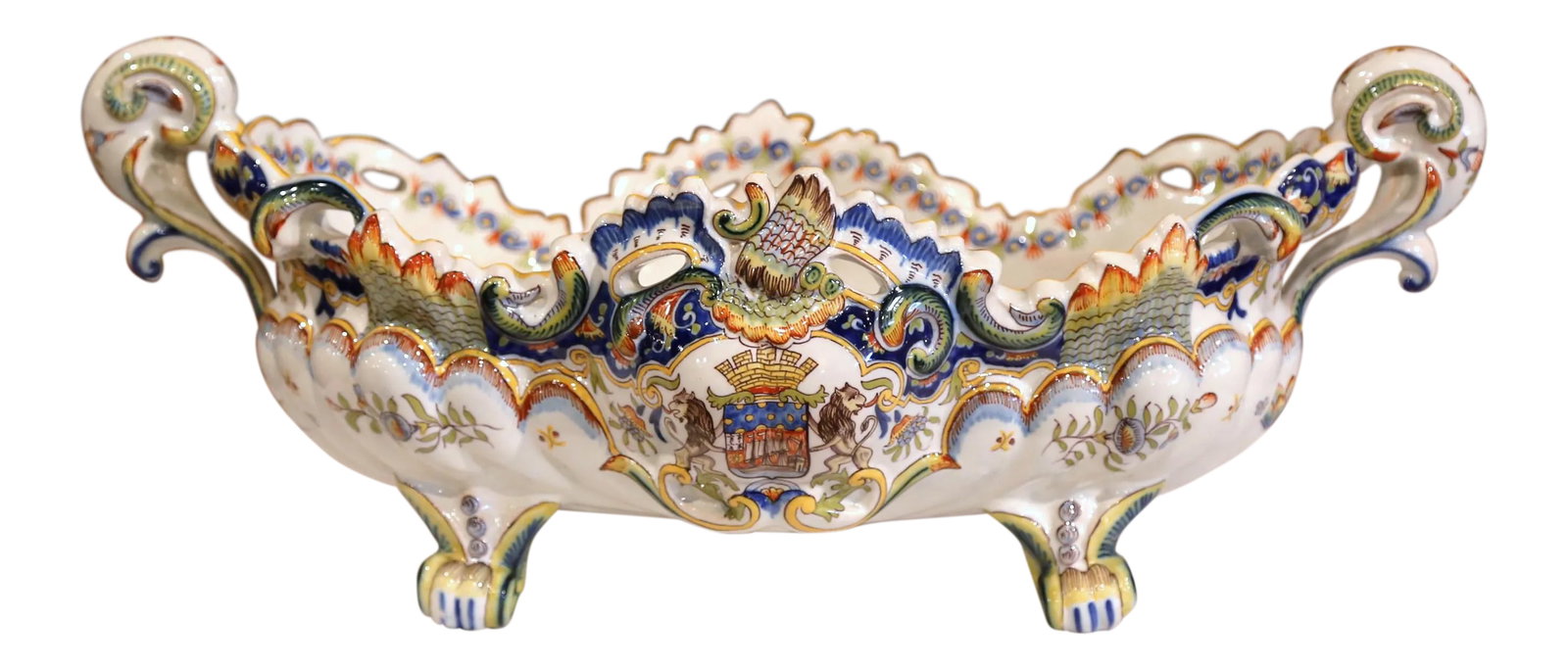 Large Early 20th Century French Hand-Painted Faience Jardiniere From Normandy: Decorate a table or a mantel with this elegant, Louis XV bowed jardiniere from northern France, circa 1920; oblong in shape, this antique planter sits on four scrolled feet, has handles on both sides