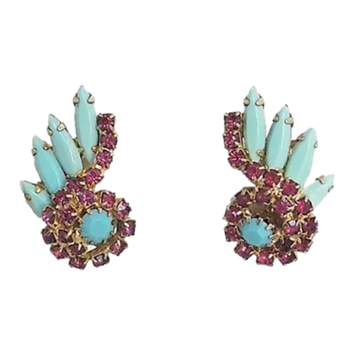 Vintage 1960s Faux-Turquoise & Faux-Ruby Rhinestone Earrings - 2 Pieces: This is part of Chairish's Costume Jewelry assortment. Goldtone faux-turquoise and faux-ruby paste clip back earrings. Unsigned. Measure: 1 1/4 inches long by 3/4 inches. Condition: Very good. Please