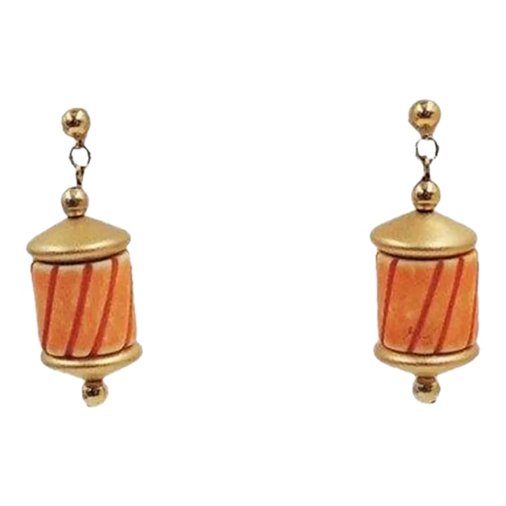 1985 Vintage Napier Hand Carved Orange Bead Pierced Earrings - 2 Pieces: This is part of Chairish's Costume Jewelry assortment. Matte goldtone and hand carved orange resin bead pierced drop earrings with push backs. Marked "Napier" on the original card and on push backs on