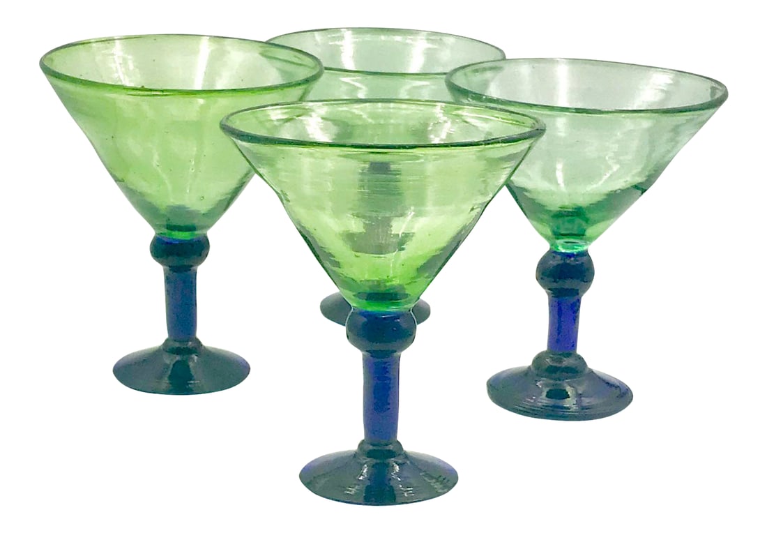 1980s Hand Blown Green and Cobalt Martini - Set of 4: Lovely artisanal rustic yet modern hand blown martini or margarita glasses. The bowl is green glass with a subtle bubble texture. The stem is a thick solid deep cobalt blue. The bottom has a rough cut