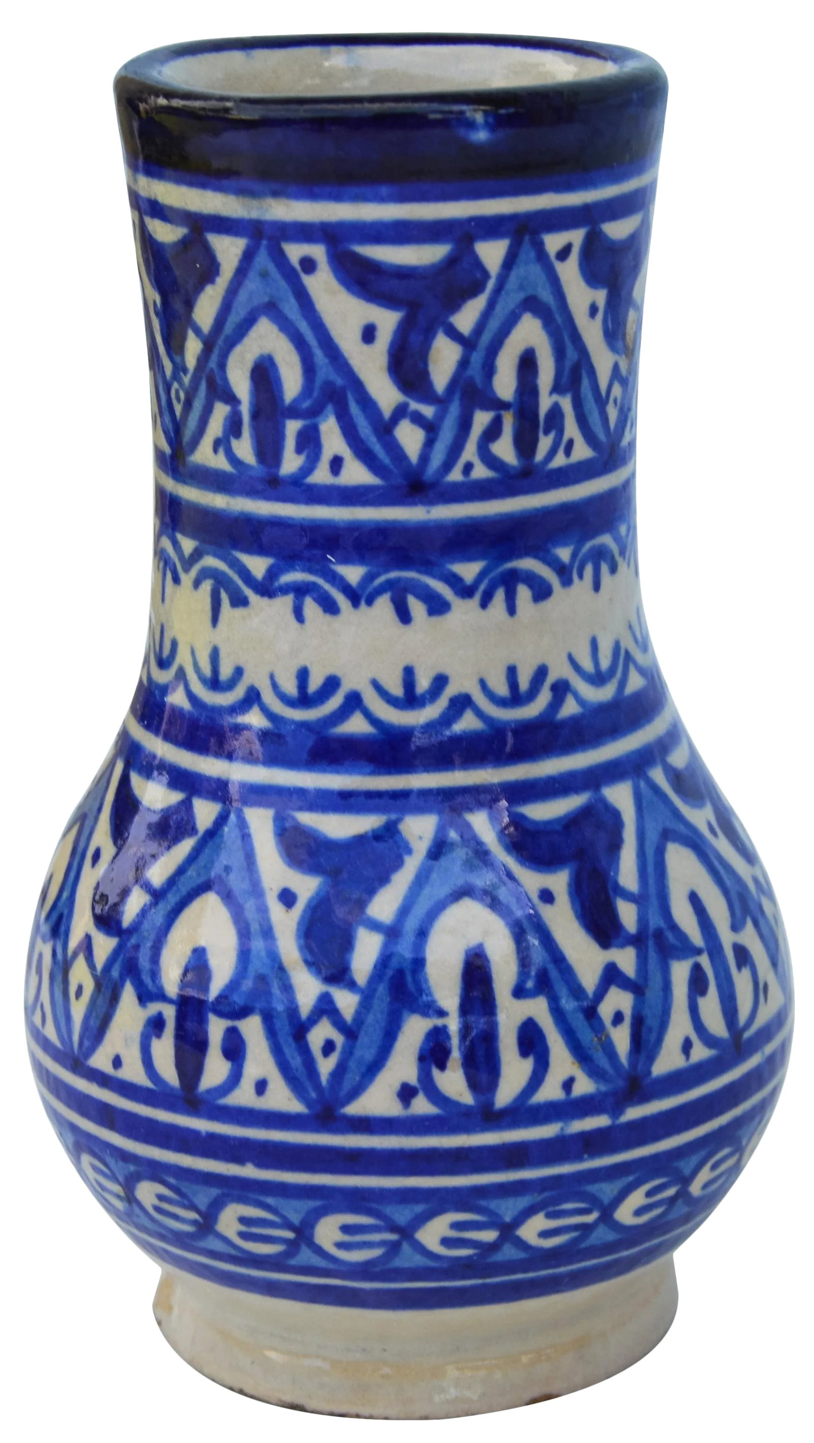 Early 20th Century Blue Moorish Ceramic Vase: Handcrafted and glazed Moroccan ceramic vase from Fez, Morocco. Exhibits an intricate hand-painted blue and white Moorish enamel. Maker's mark on undersides. This beautiful accent ships within 1-2 bus