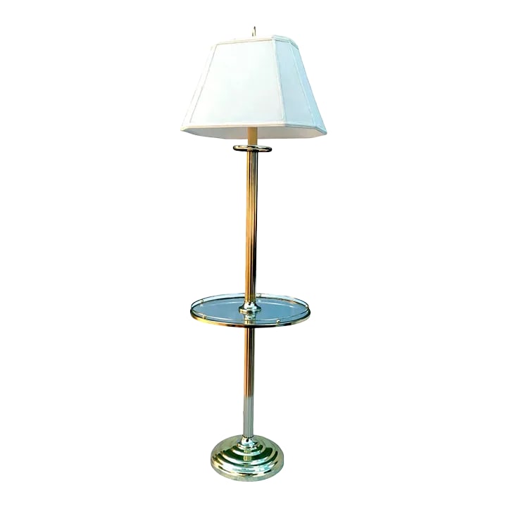 1980s Fluted Brass Floor Lamp With Galleried Glass Tabletop: Vintage polished brass finish metal round glass side table floor lamp in the style of Frederick Cooper., circa 1970s. It features a solidly constructed cast metal round puddled base, a fluted center p