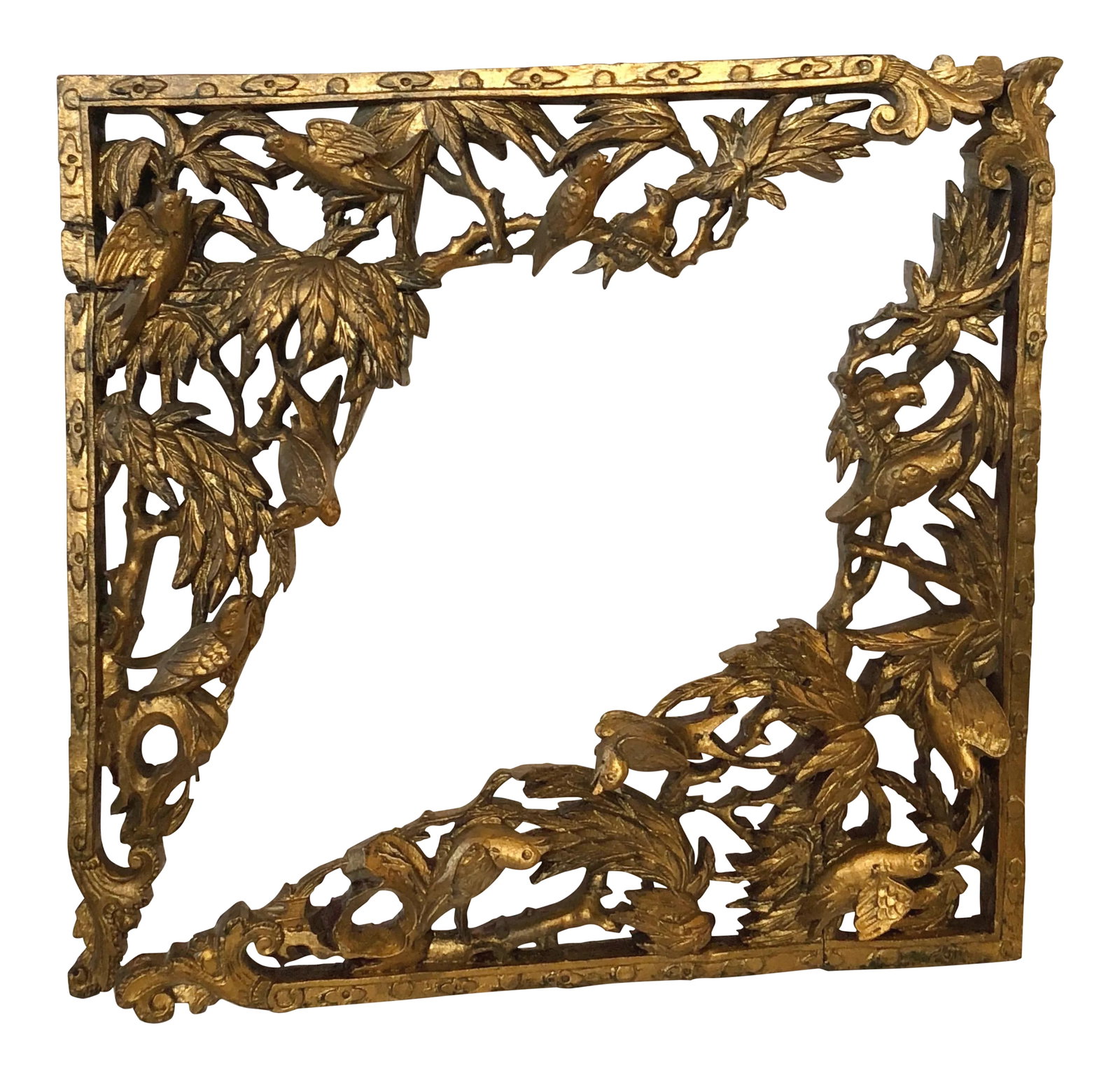 Old Chinese Gilt Wood Fragments, Pair: Deeply hand carved gilt wood brackets a corner, together in an entry or hanging on a wall as art. Though this is a pair that match, they are not identical as each is fashioned with different pairs of 