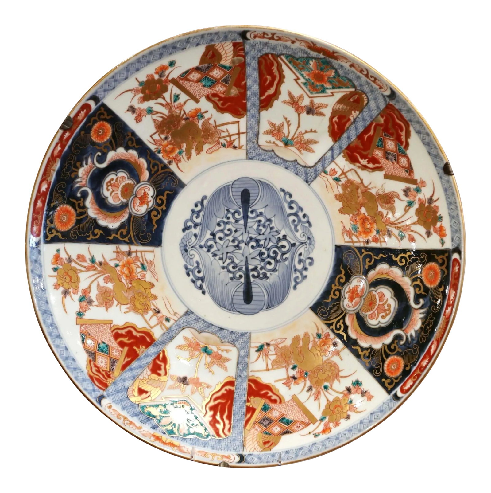 19th Century Japanese Hand Painted and Gilt Porcelain Ilmari Wall Charger: Decorate a wall with this large, porcelain Imari import charger. Crafted in Japan circa 1890, the important Asian ceramic platter features hand painted floral decor with gilt accents. The exotic charg
