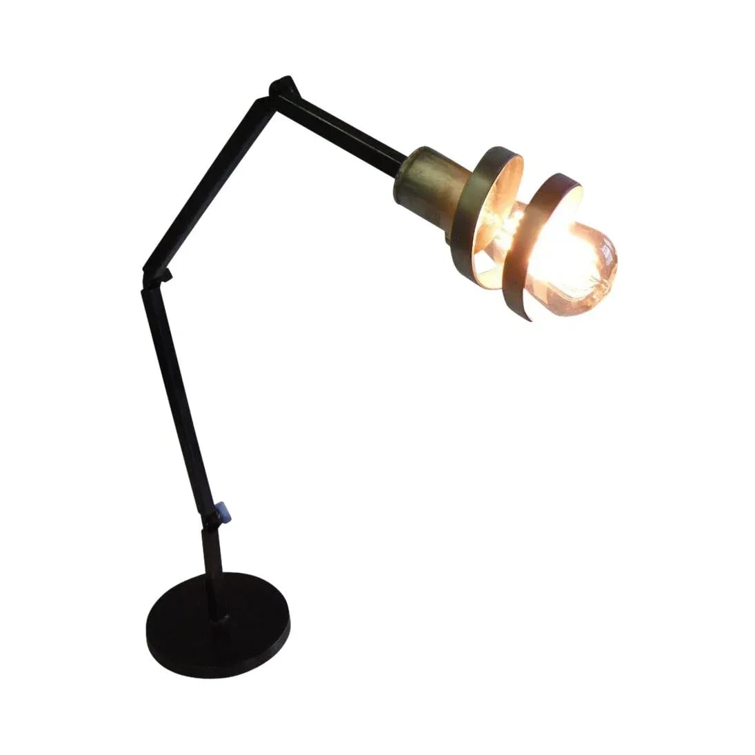 Crane Spirale Desk Lamp: Inspired by the permanent aerial ballet taking place in the New York skyline. This crane desk lamp is a simple and elegant reference to classic engineering. Combining aluminum, steel and bronze this