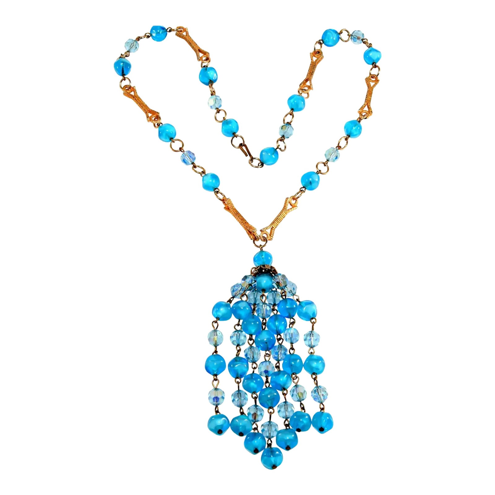 Vintage Tassel Necklace Caribbean Blue Glass Beads: This is part of Chairish's Costume Jewelry assortment. Vintage necklace with 4 1/2" tassel dangling from a chain made using Caribbean blue glass beads, iridescent accent beads, and gold plated