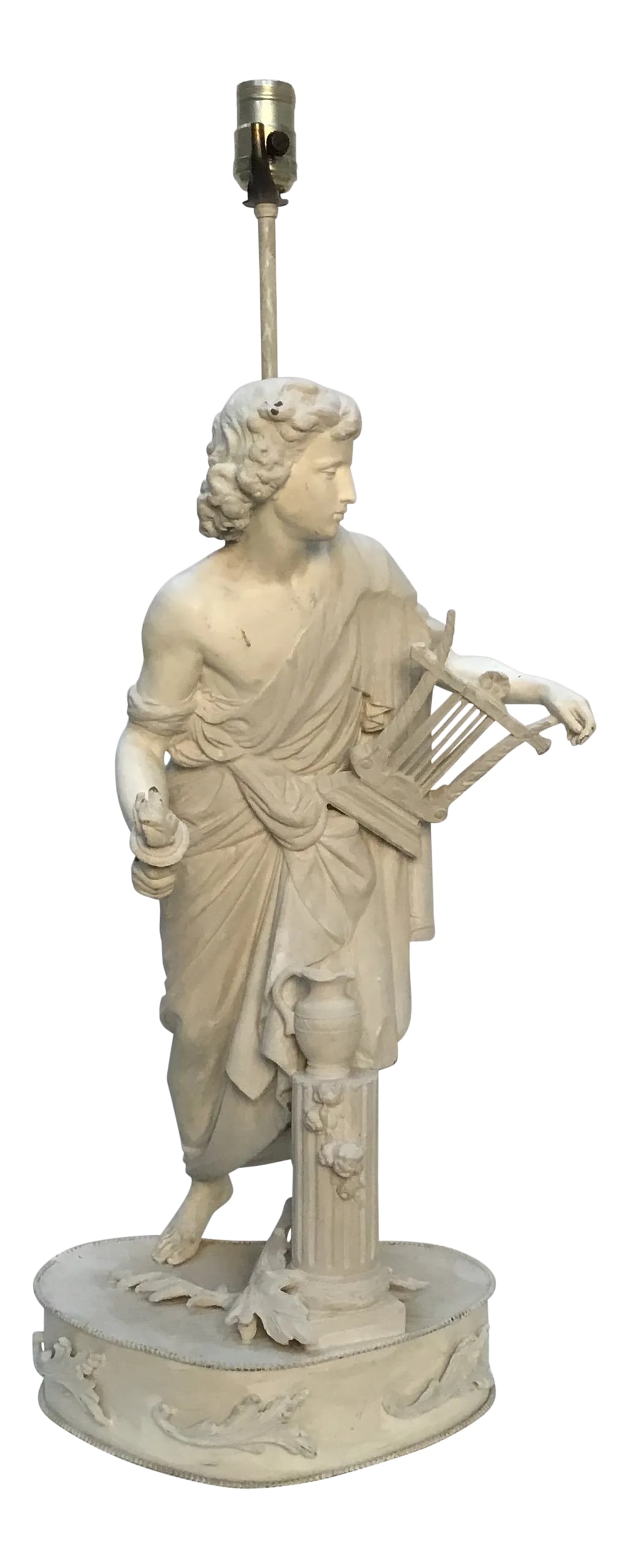 Vintage Classical Figure Sculptural Table Lamp: A beautiful figure of Apollo holding a harp and a torch among classical ruins and fallen branches. Metal, painted alabaster white. In working condition. The torch is removable. Condition: Alterations:
