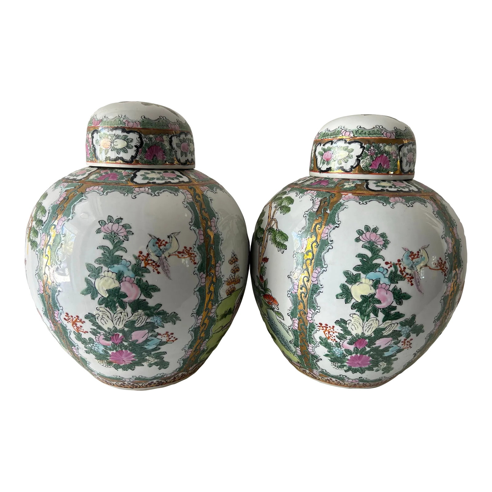 Pair of Vintage Famille Rose Lidded Ginger Jars: Starting in the 18th century, Europeans provided an eager market for Chinese export porcelain, especially the colorful and fanciful ware known as "famille rose." Named for a palette of opaque overglaz