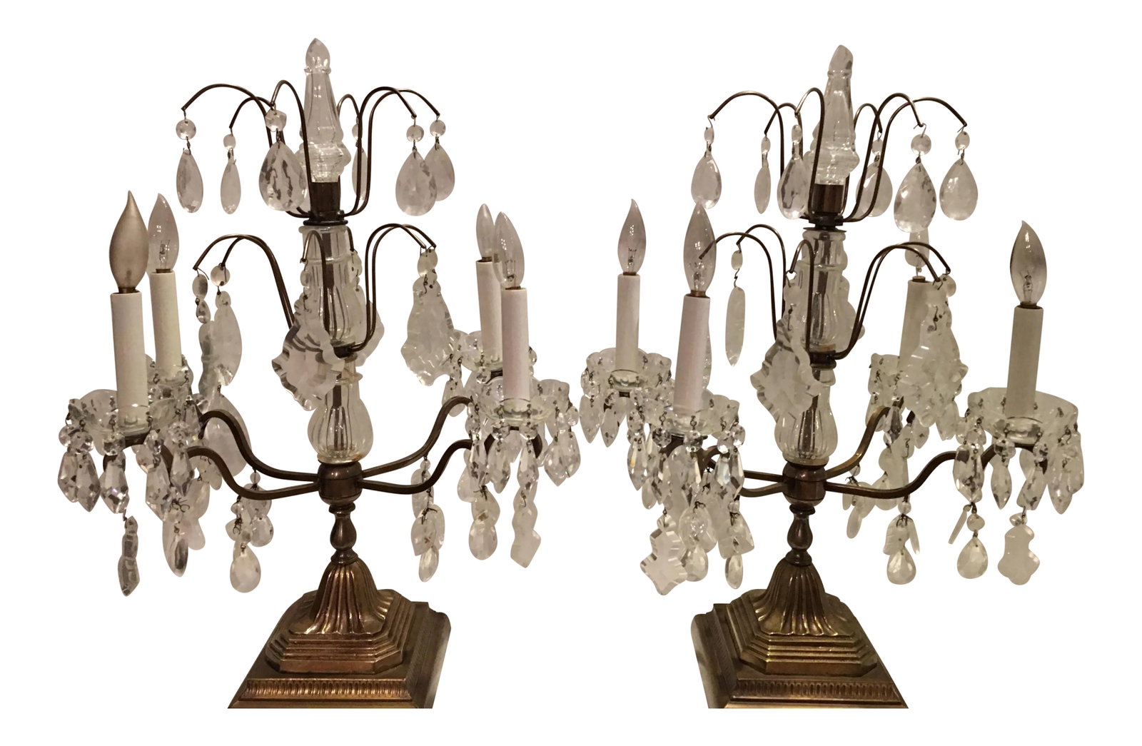 1940s Neoclassical 1940's French Style Girandoles - a Pair: Exquisite pair of French style Girandoles from the 1940's. Five different styles of faceted crystal prisms on four arms with a solid brass base. Each measures 22" high x 14.5" x 11". Base measures 6