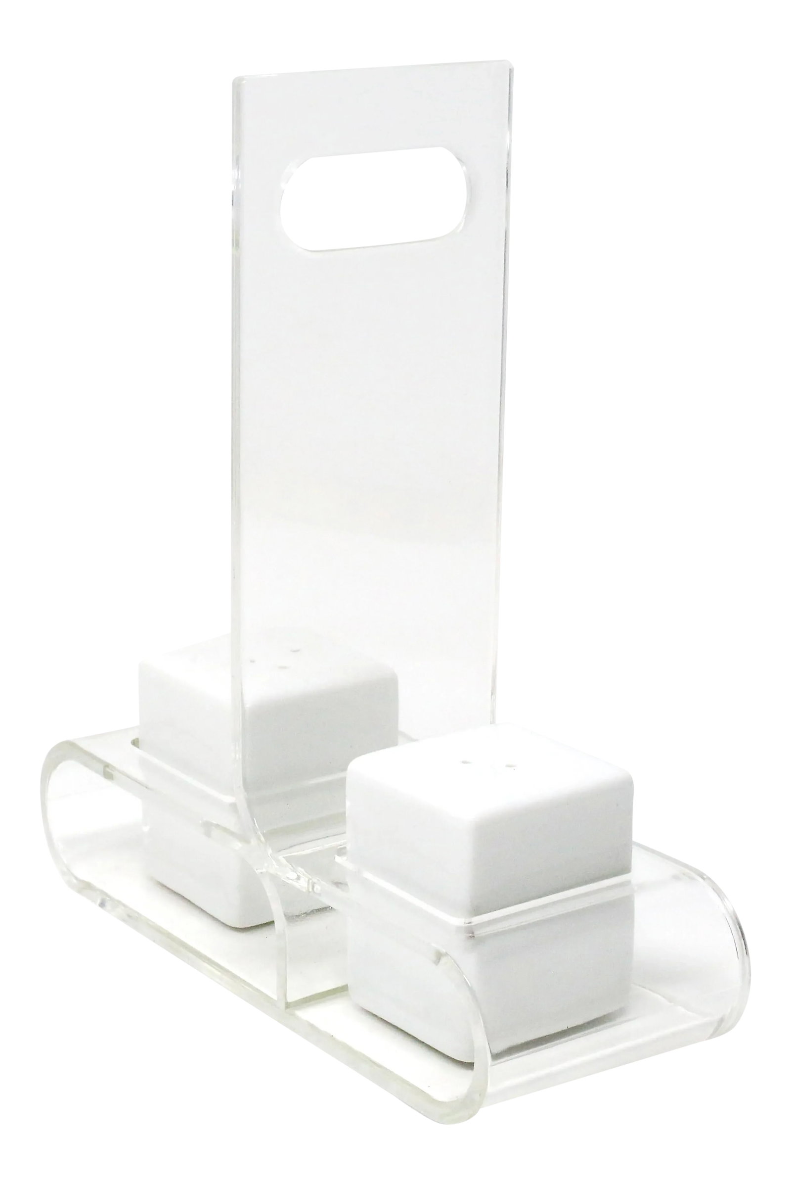 Ceramic Salt and Pepper Shakers With Lucite Holder - Set of 3: A vintage set of white ceramic salt and pepper shakers with a rectangular form, and a bent lucite holder/carrier. Good vintage condition. 8" x 7 1/4" x 2 3/4" Condition: Alterations: Original
