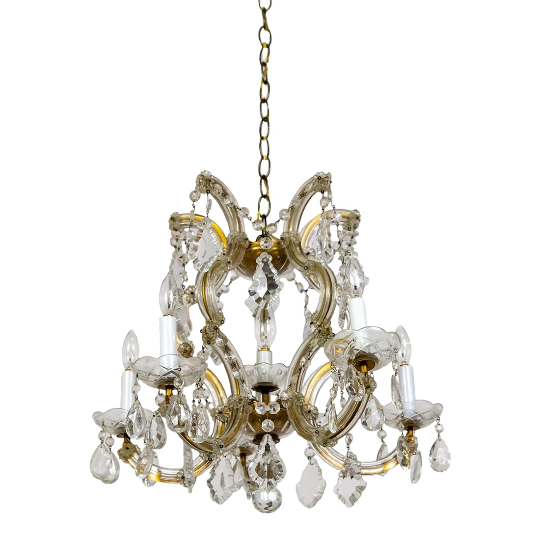 1950s Maria Theresa 6-Light Chandelier: A Maria Theresa style chandelier from the 1950s. It has 5 arms with candle-style lights and a center light. With lovely French pendeloque cut crystals. 20" diameter x 17" height, 42" overall height.