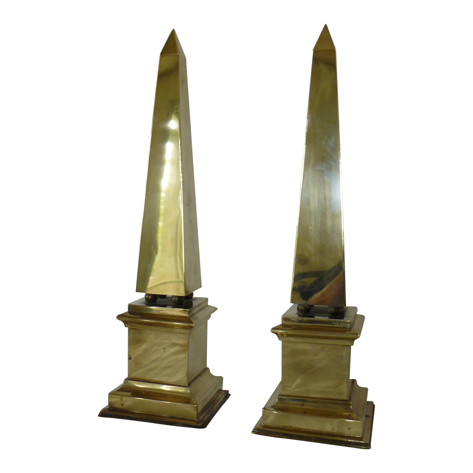 Pair of Vintage Brass Obelisks: Impressive pair of vintage Brass Obelisks, measuring 21 5/16" tall and 6 1/8" across at the base. Some age related but dings (see photos or request more pics) and surface abrasions (also shown in phot