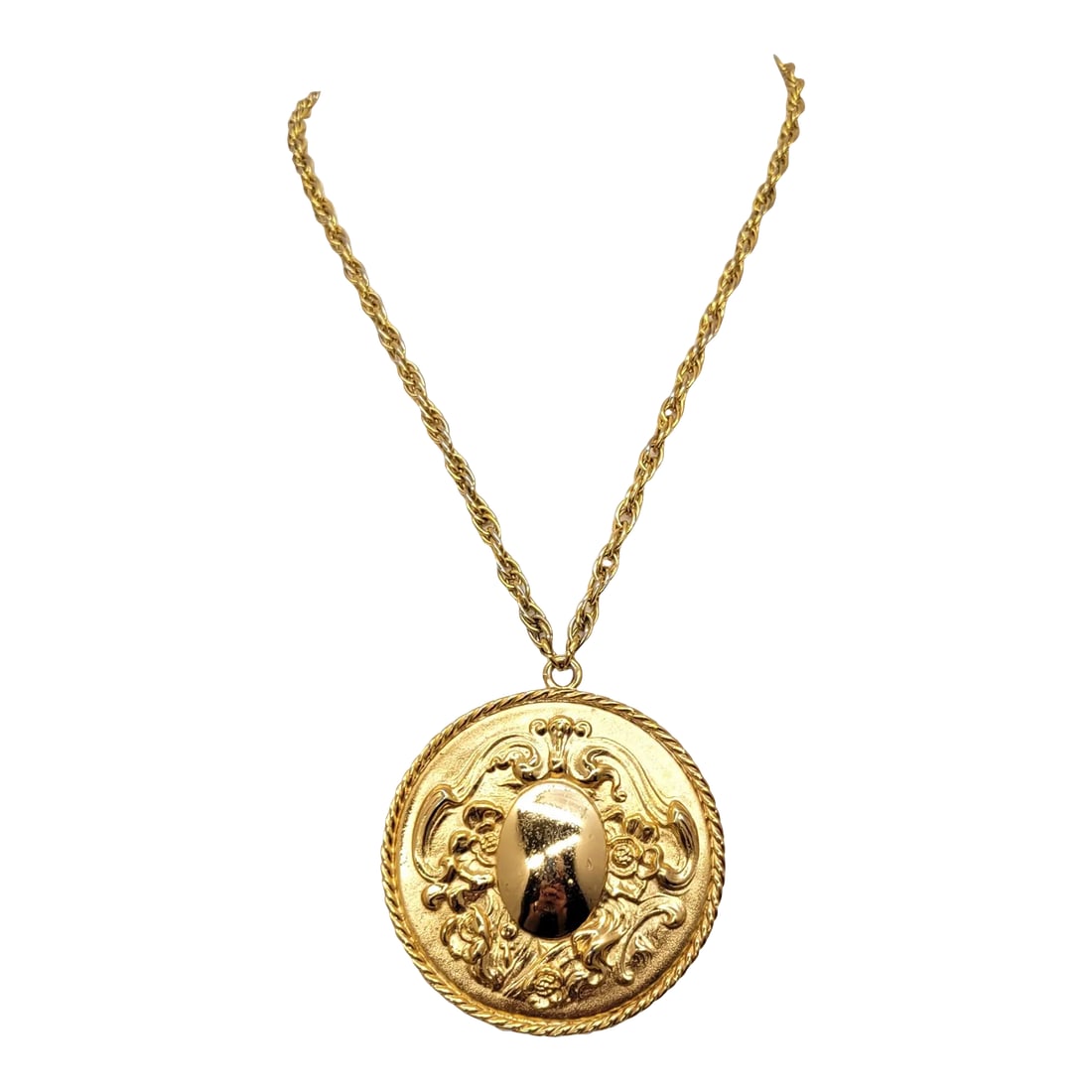 Vintage 1960s Signed Napier Baroque Style Goldtone Round Pendant Necklace: This is part of Chairish's Costume Jewelry assortment. 1960s Baroque style goldtone round repousse with oval domed center and floral & decorative surround pendant necklace with spring ring clasp.