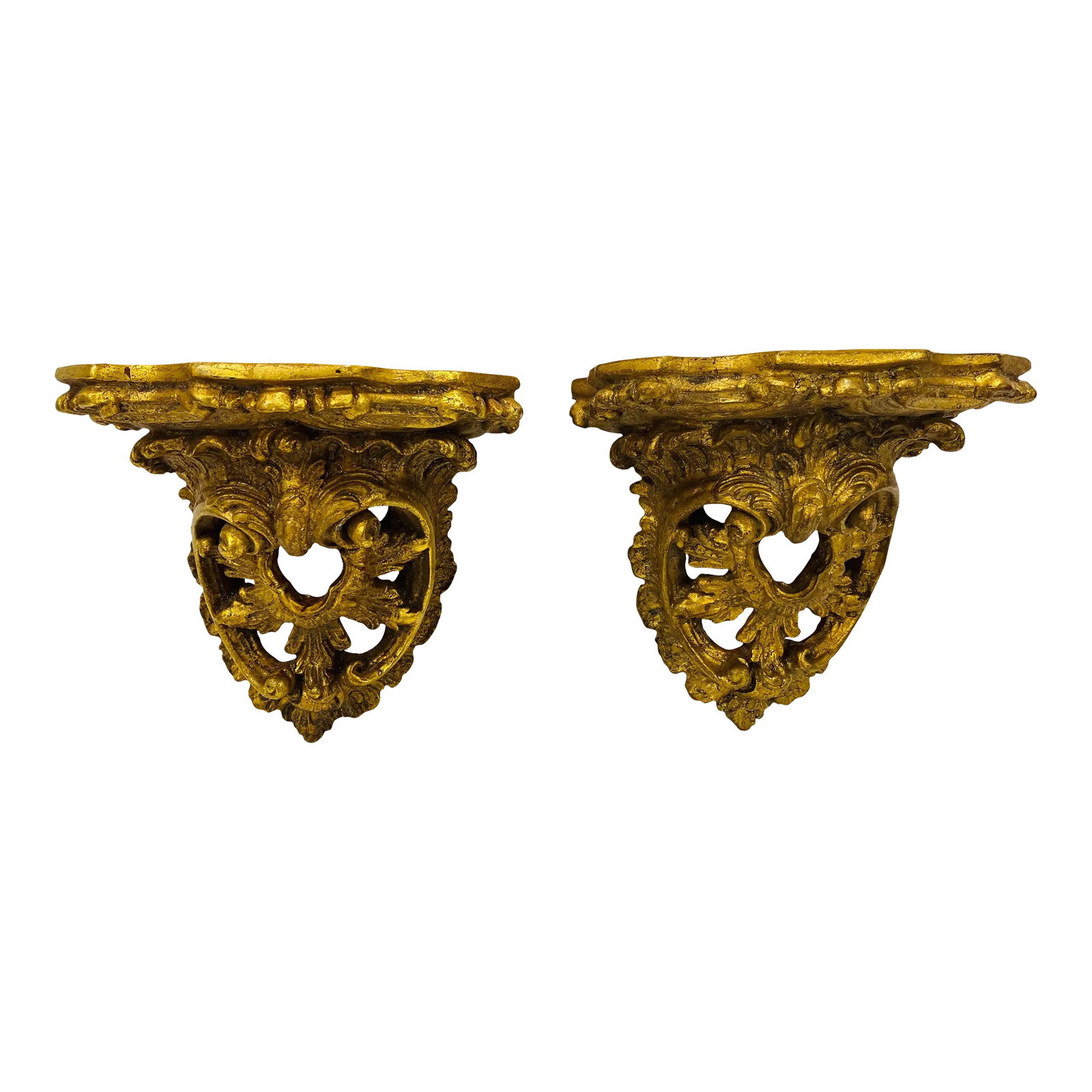 Pair of 1960s Italian Gold Leaf Brackets: This pair of cast plaster brackets were made in Italy and signed Prosperi (Italian for wealthy) In the Baroque style The gold leaf has a glaze to create an antique patina Condition: Alterations: