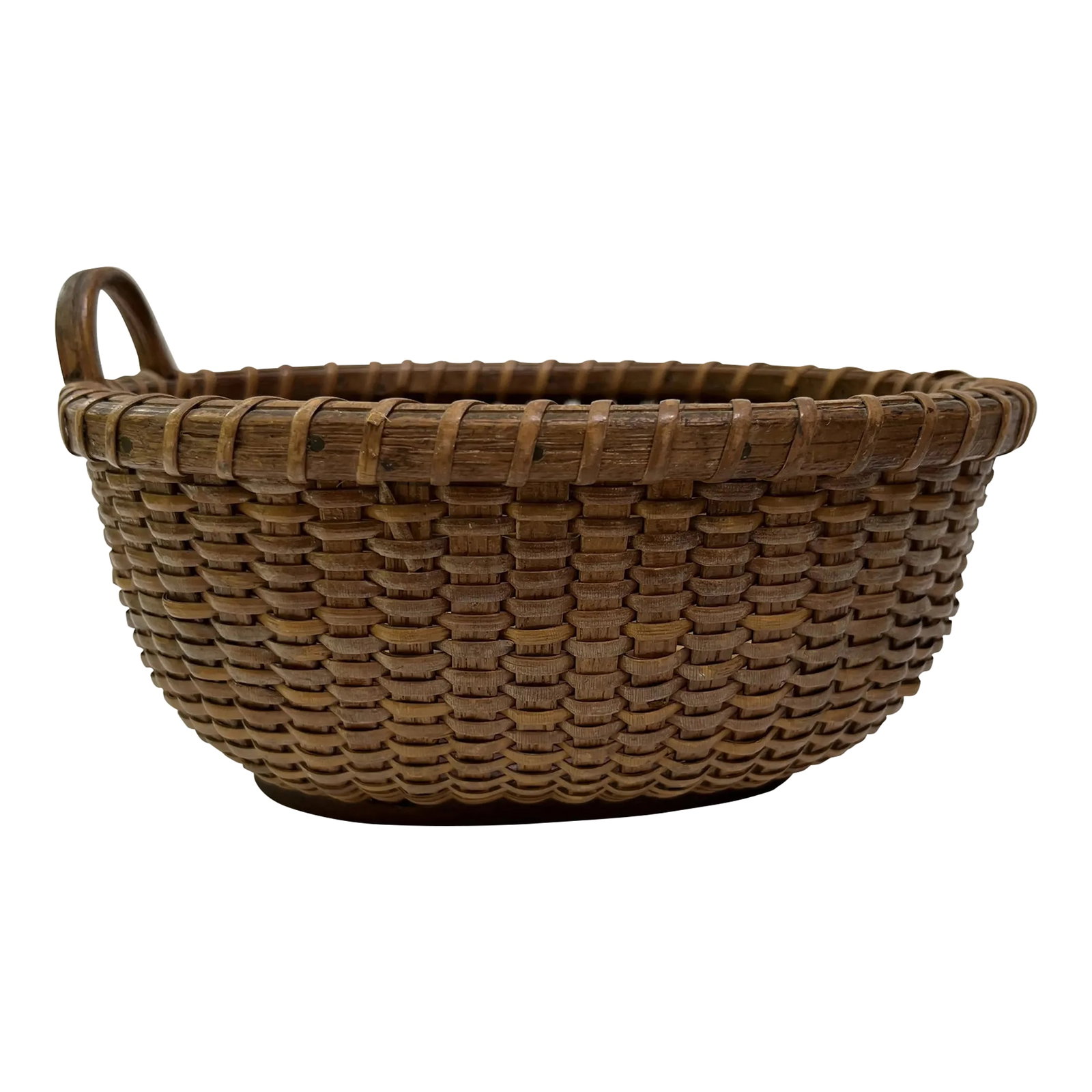 Antique Nantucket Basket: A single antique small oval shaped Nantucket lightship style basket with solid wood base and single loop handle. Retains original hand written tag by Frederick S . Chadwick (1857-1936). Condition: Alt