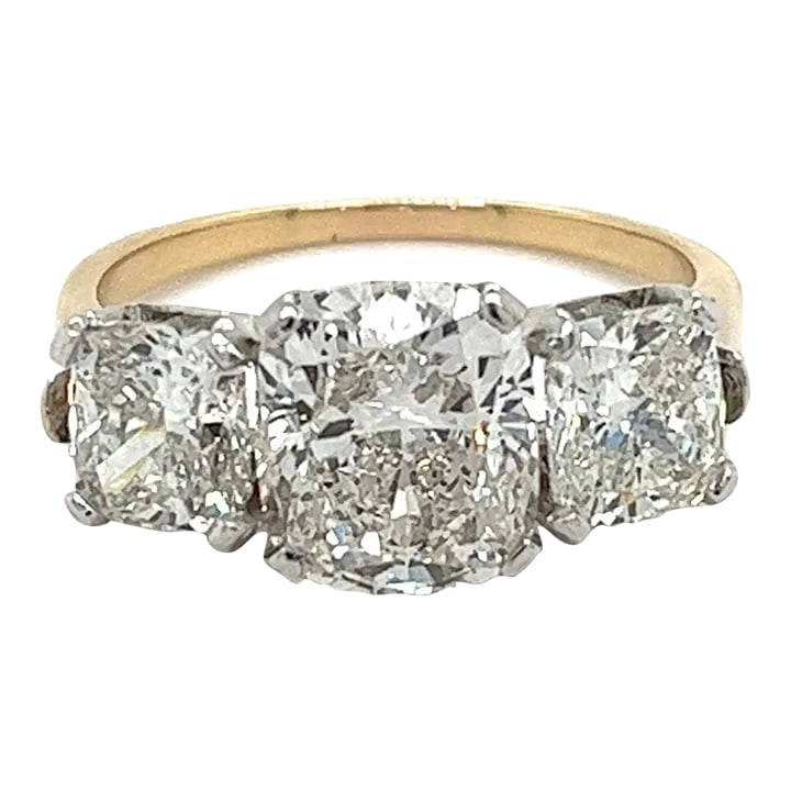 Mid 20th Century 4.83 Carat Cushion Cut 3-Stone Lab Grown Diamond Ring in 14k Gold and Platinum Size: 4.83 carat total cushion cut lab grown diamond three stone ring. Set in a 14k yellow gold shank and platinum basket with 4-prong closure. The center stones are lab grown diamonds via CVD growth. Set w