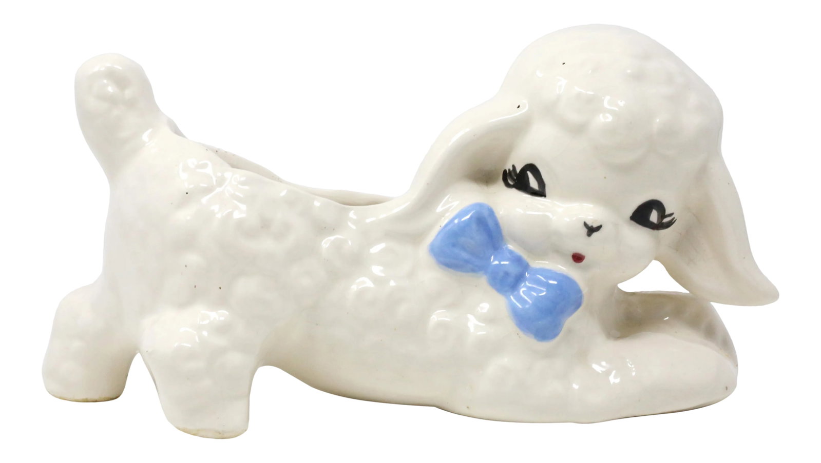 Vintage Ceramic Lamb Planter: A vintage ceramic planter in the form of a playful lamb with a blue bowtie. Good vintage condition; minor wear consistent with age and normal use. Condition: Alterations: Original Condition Unaltered