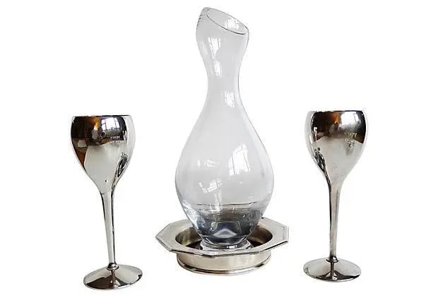 Vintage Silver & Glass Wine Serving Set of 4: Four-piece serving set including a California carafe (13"H x 5"Dia) marked "BV", a pair of silverplate wine glasses (8"H x 3"Dia) marked "Kirk Steiff" from Spain, and American Sheffield silverplate co