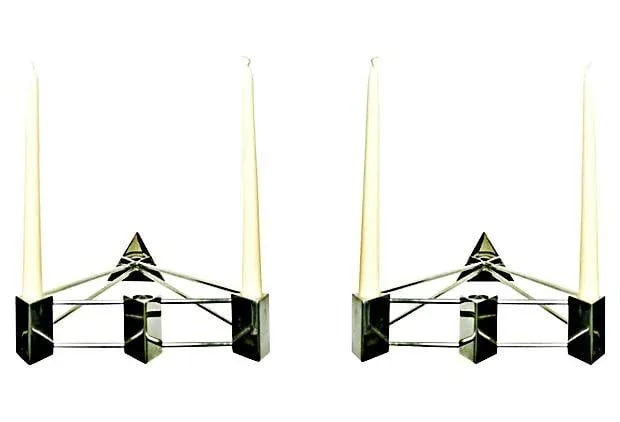Modern Stainless Steel Sconces - Pair: Dynamic shape, pair of stainless steel candlesticks. Each holds two or three candles. Condition: Alterations: Original Condition Unaltered Imperfections: Some Imperfections Condition Notes: Excellent