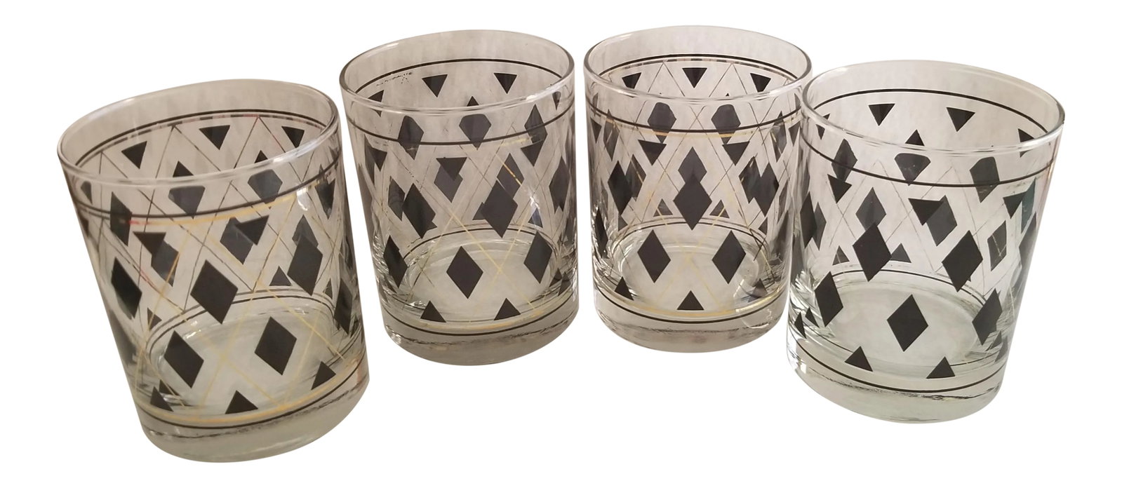 1950's-1960's Argyle Black and Gold Diamond Shapes Rocks Glasses - Set of 4: We love this extraordinary set of rocks glasses because they are unmistakably straight out of the 50's and 60's with their argyle pattern with black diamond shapes and metallic gold trim! This is a