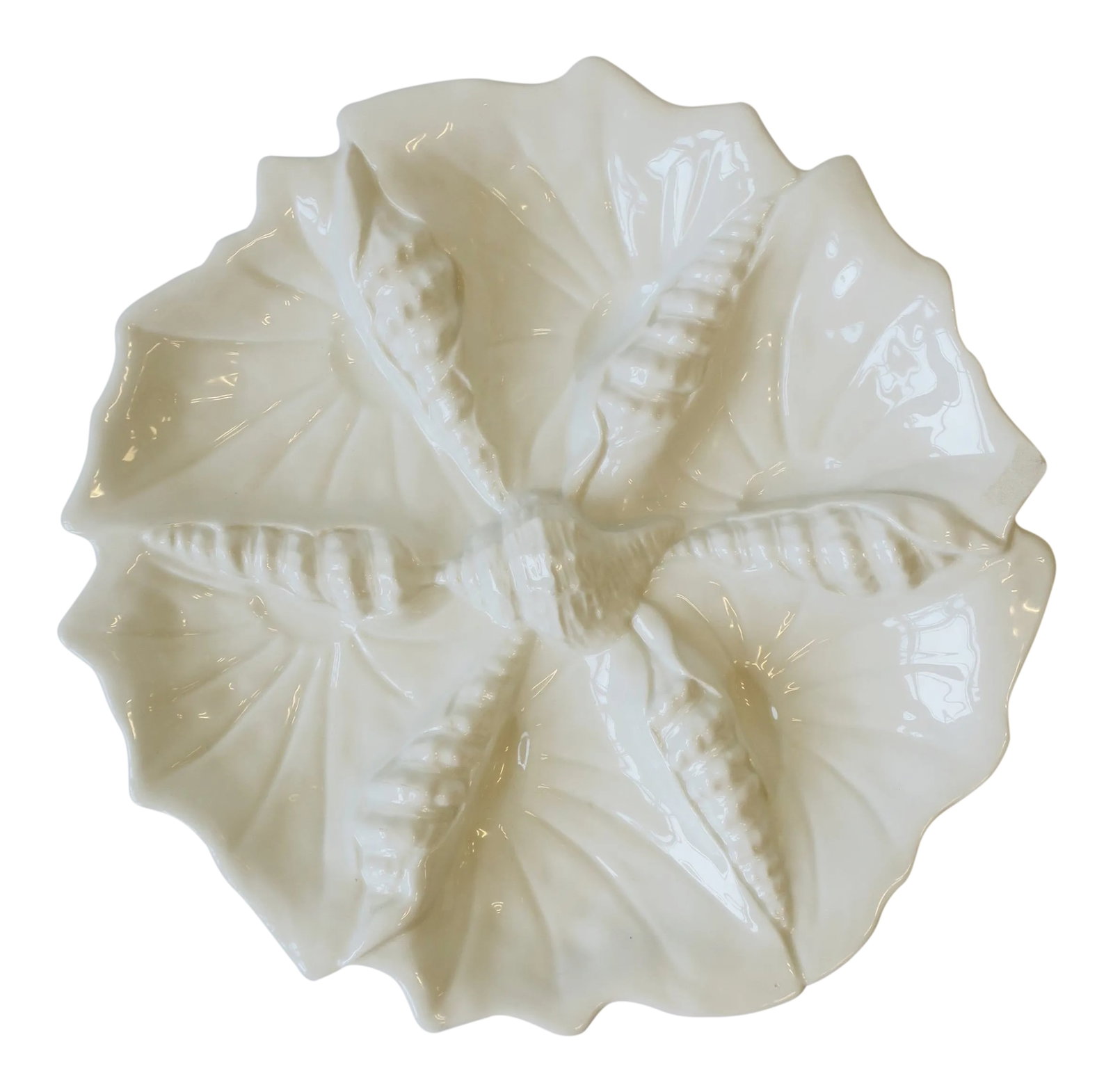 Italian Seashell White Ceramic Serving Dish From Italy for Bergdorf Goodman: A great entertaining Italian ceramic seashell serving dish. Great for cheese, olives, etc. Marked "Made in Italy Expressly for Bergdorf Goodman" on label on bottom as shown in images. Measures: